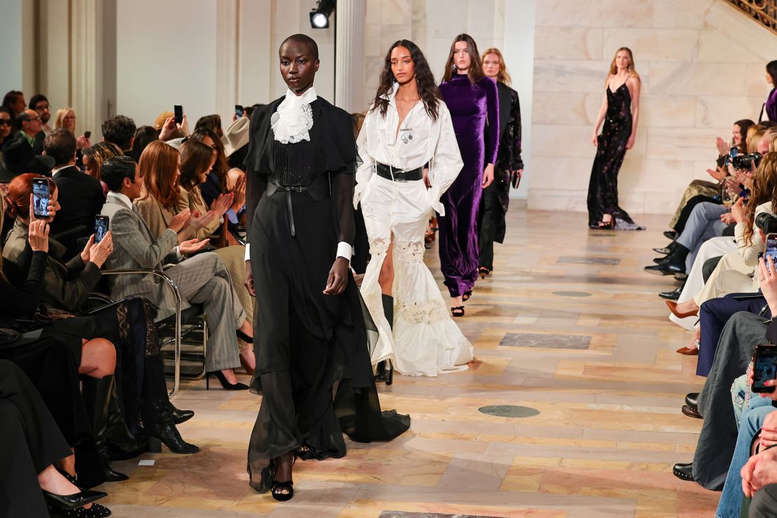 Models Anok Yai, Mona Tougaard and Vivienne Rohner walk the runway in dark, bohemian looks.